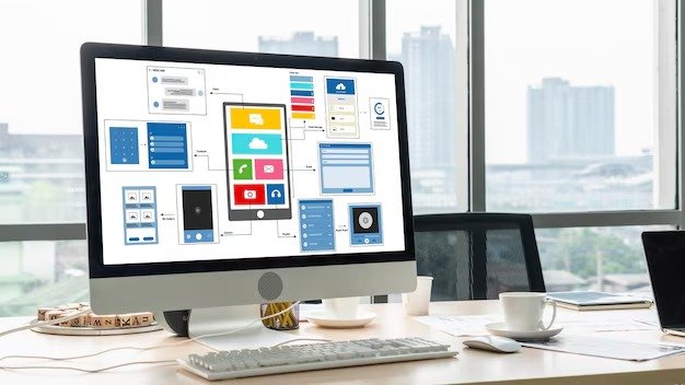 Image showing website interface mockups and layout structures on a desktop monitor, illustrating UI/UX design planning and conversion-focused website optimization, featured in the article “How UI UX design services in Dubai increase website conversions.”